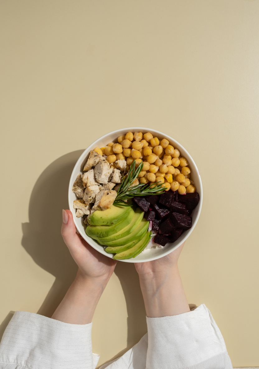 Person Holding a Bowl of Healthy Food